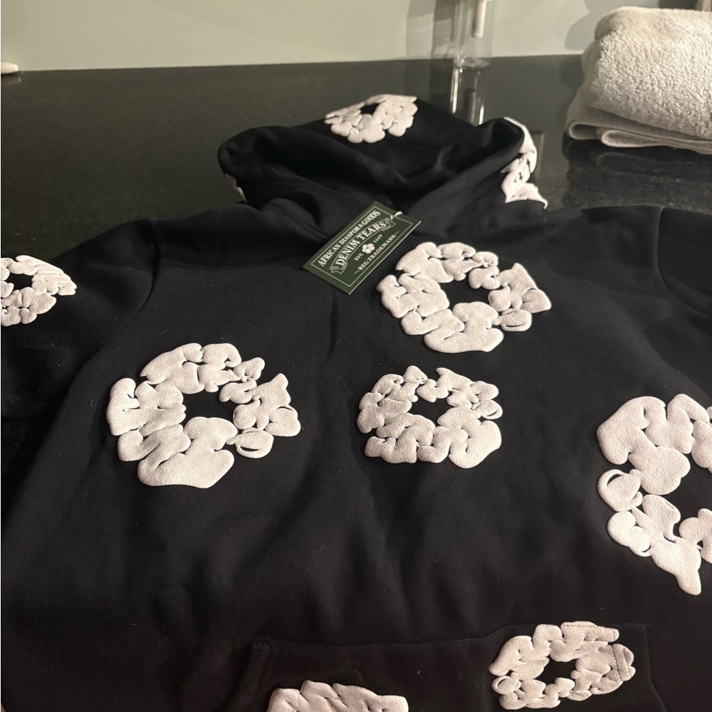 Denim Tears Black Hoodie with White Floral Patterns
